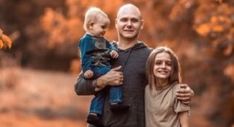 Evan with his family before donating hair