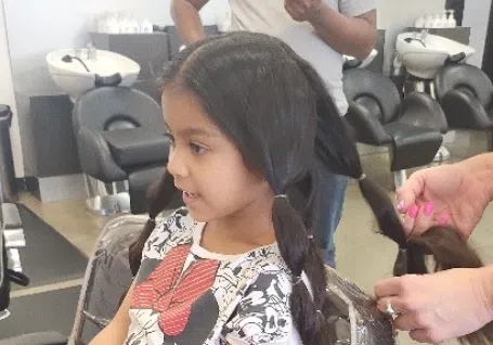 Click to read article: Sabella Shares Her Hair to Help Others'